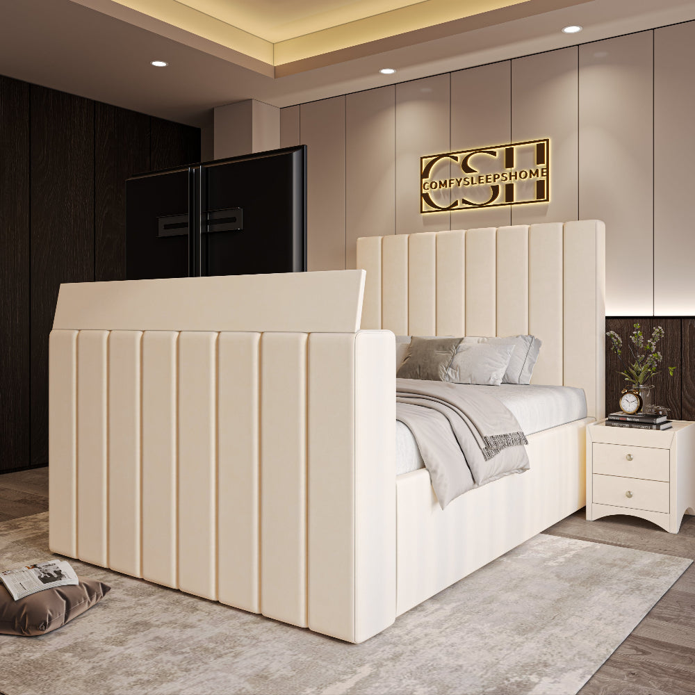 A chic cream upholstered 2025 Fiorentina TV Bed with a tall, channel-tufted headboard and integrated TV, set in a contemporary bedroom.