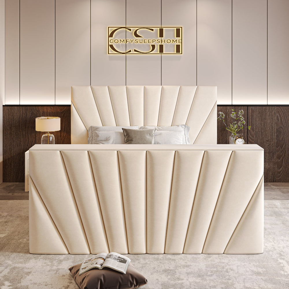 A sophisticated cream 2025 The Chelsea TV Bed with a panelled, winged headboard and a grand, vertically-ribbed footboard in a chic bedroom.