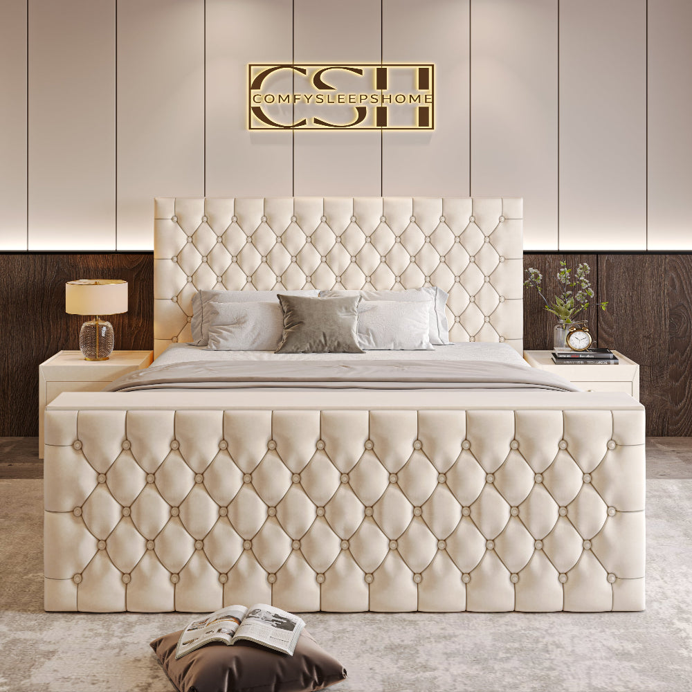 A grand cream 2025 The Chiswick TV Bed with deep diamond tufting on both headboard and footboard, dominating a modern bedroom.
