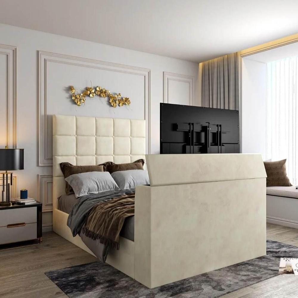 Modern bedroom with a cream upholstered Windsor Tv bed, gold wall art, and a hidden TV lift mechanism.