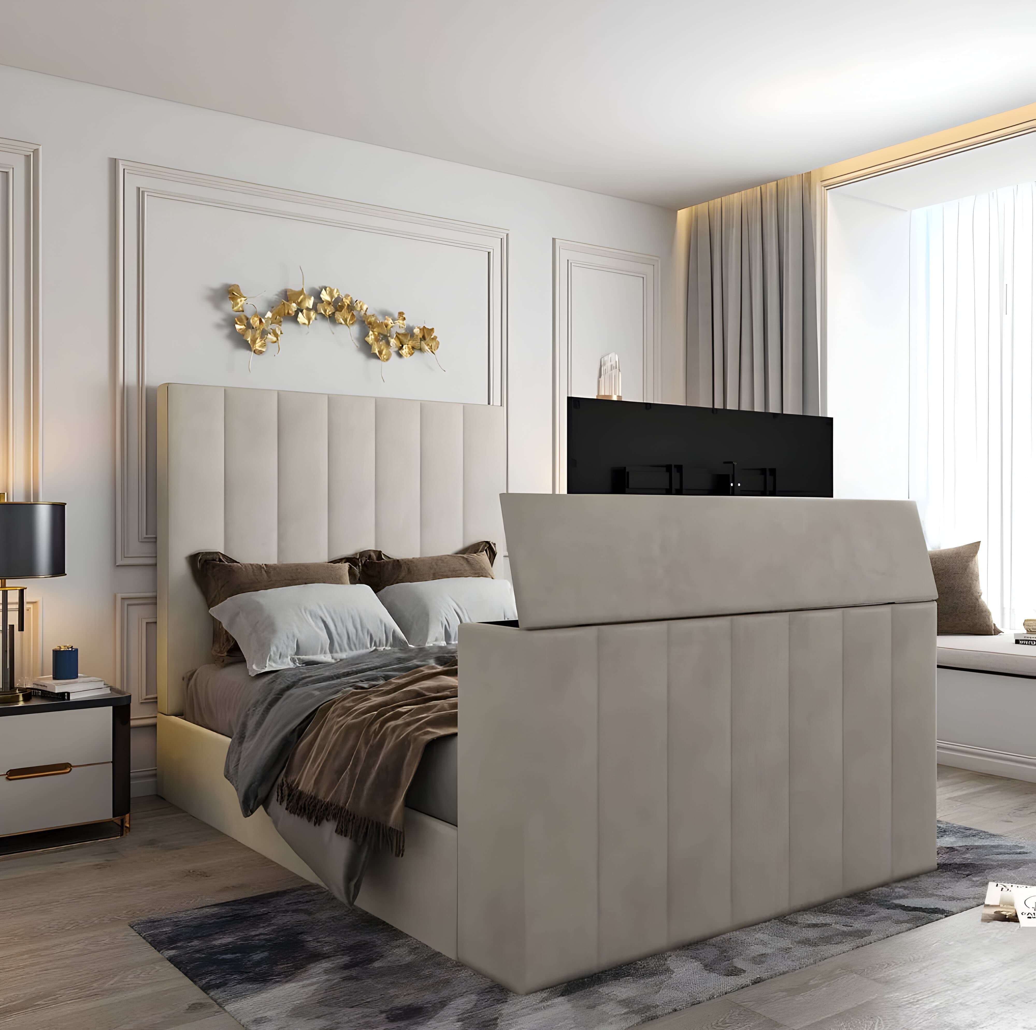 A modern bedroom features an electric adjustable upholstered bed with a TV in the footboard, complemented by golden wall decor and soft neutral tones.