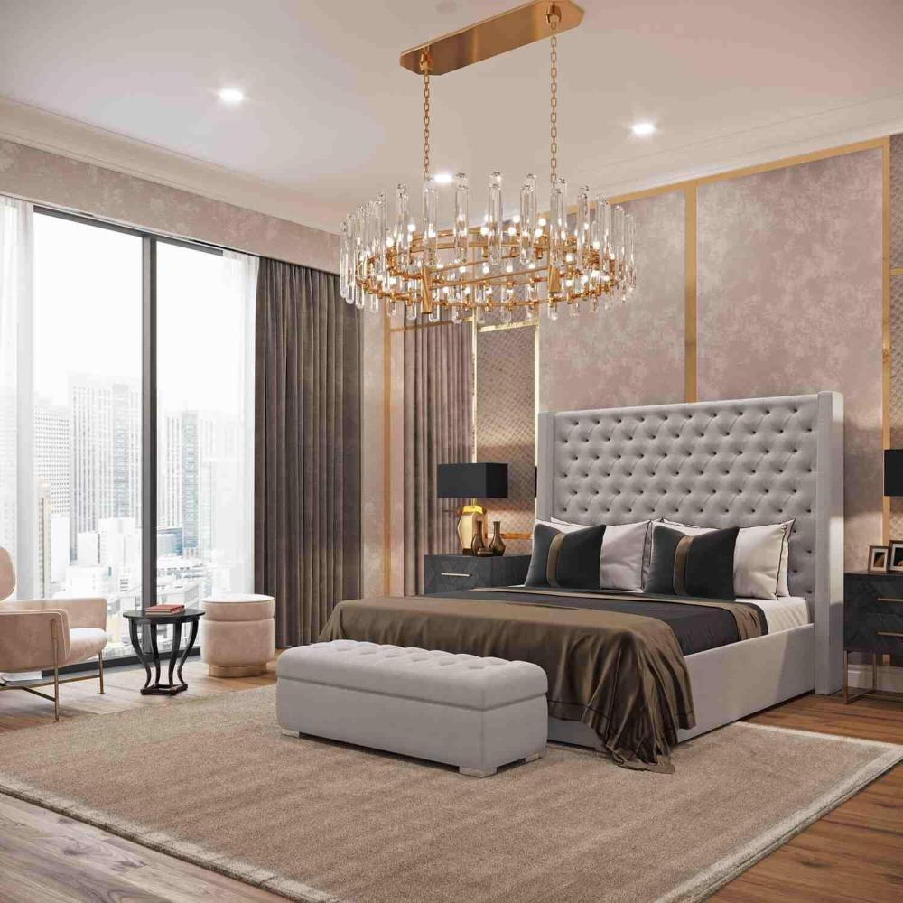 Luxurious bedroom with tufted headboard and grey upholstered ottoman bed.