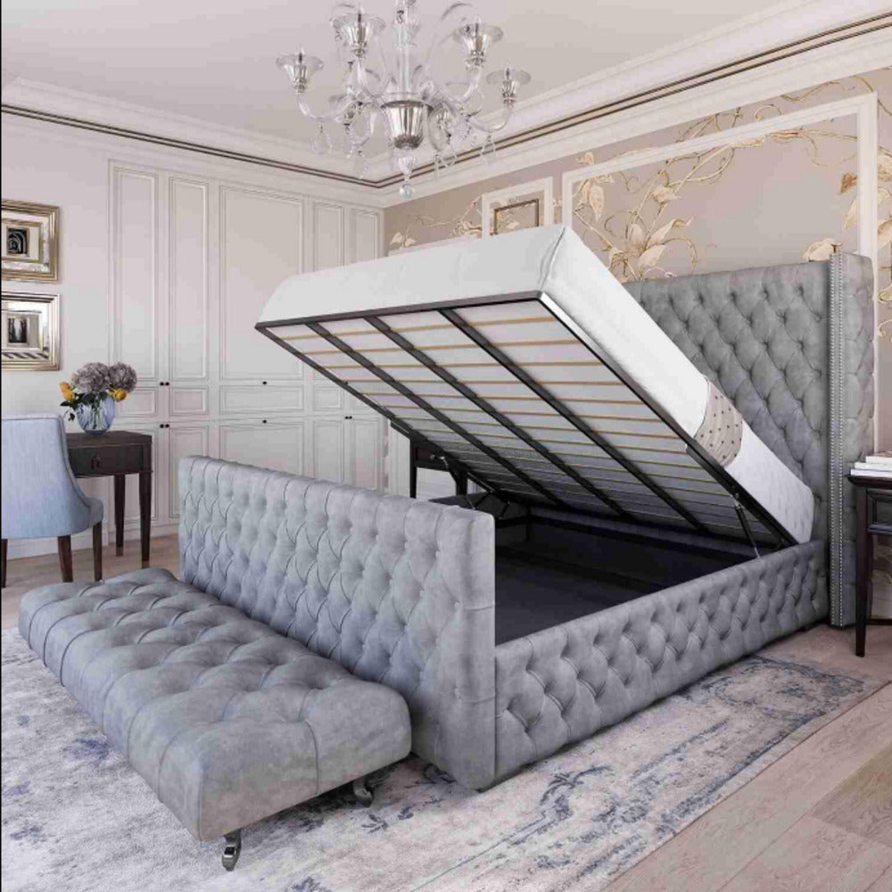 Bedroom with a side-opening ottoman bed and storage beneath, featuring tufted grey upholstery.