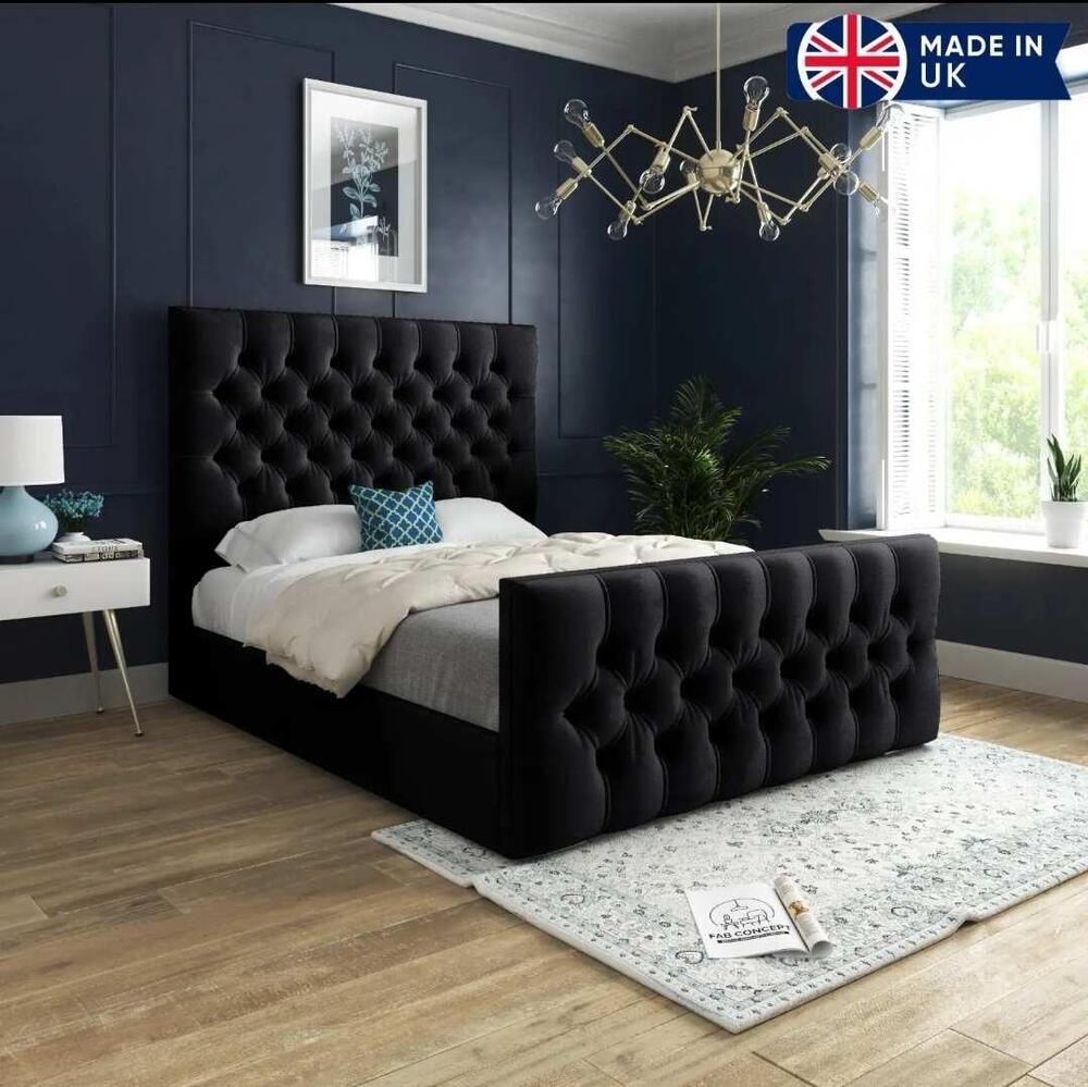 Modern Single wooden bed with black tufted bed, chandelier, and blue walls.
