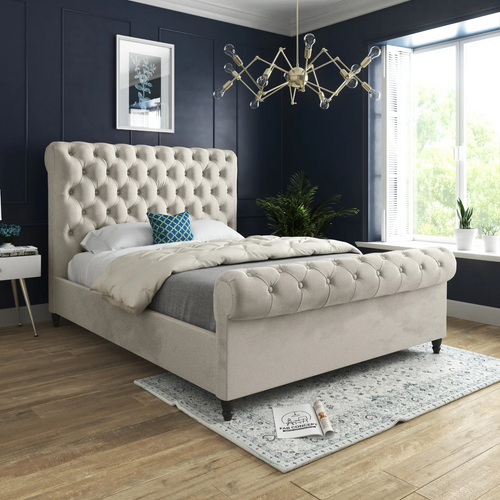 Luxurious bedroom with a button-tufted upholstered Wooden Sleigh Bed, modern chandelier, and navy walls.