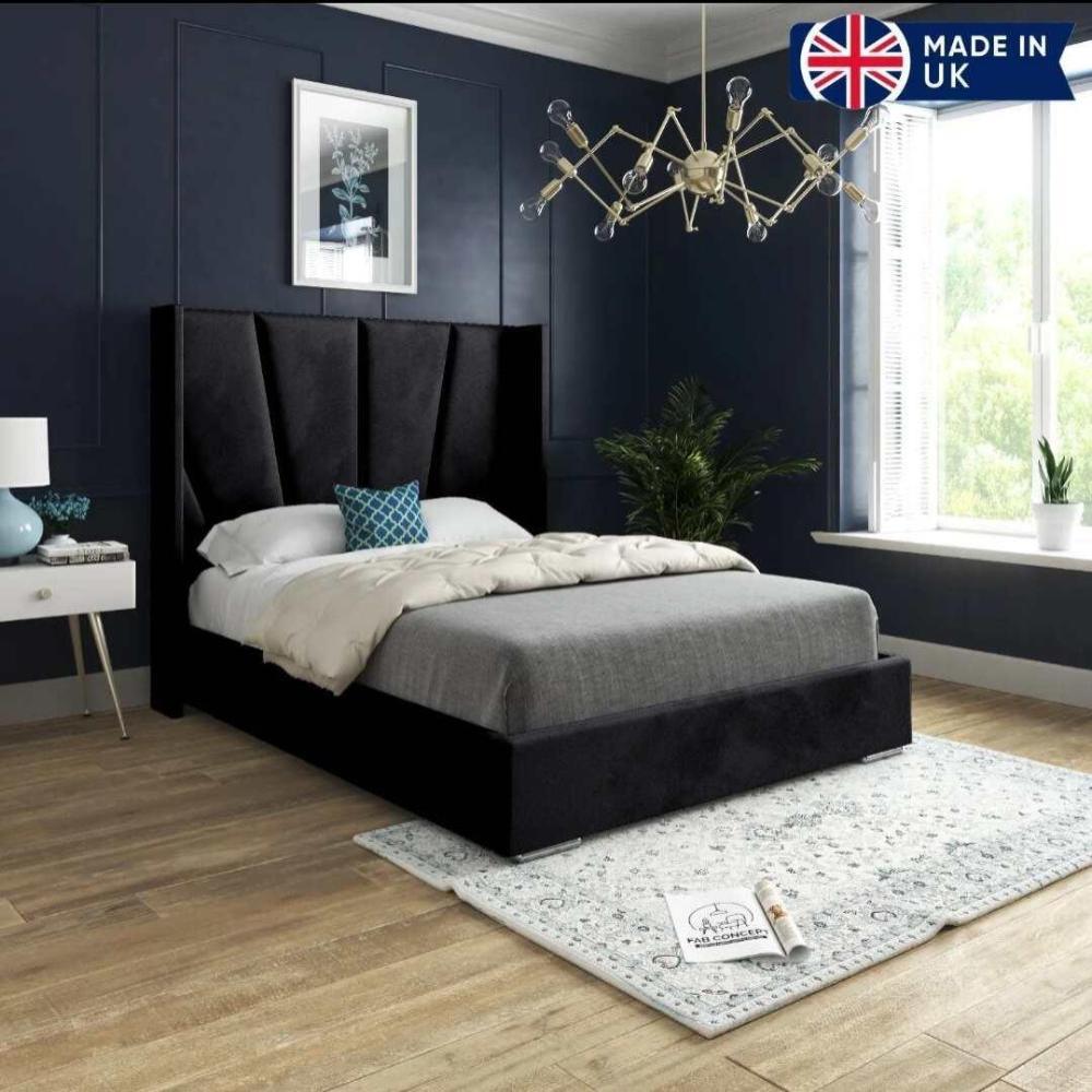 Bedroom with a black double bed frame, dark blue walls, and a large window.