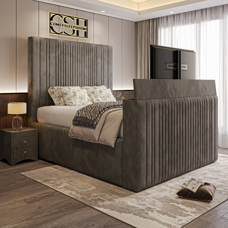 A sophisticated grey 2025 Belgravia TV Bed with a tall, fluted headboard and footboard, featuring a hidden TV in a modern bedroom.