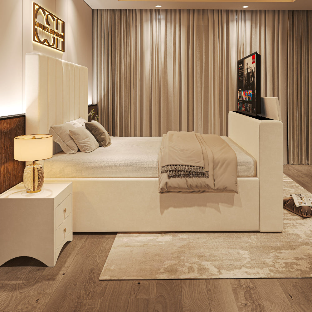 A luxurious white 2025 Fiorentina TV Bed with an upholstered headboard and a discreet pop-up television, in a chic bedroom.