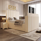  A contemporary cream upholstered 2025 Fiorentina TV Bed with a tall, channel-tufted headboard and integrated TV, in a modern bedroom.