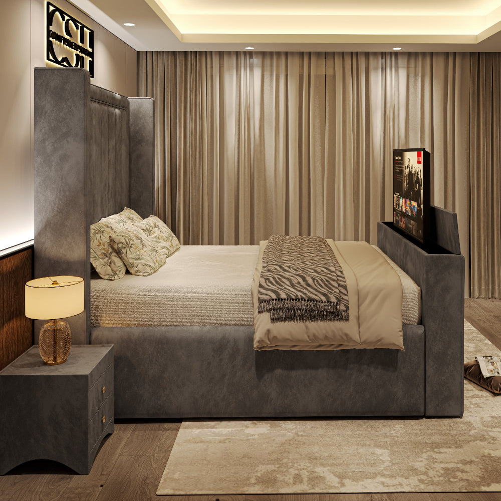 A sophisticated grey upholstered 2025 The Astoria TV Bed with an tall, elegant headboard and integrated TV, in a stylish bedroom.