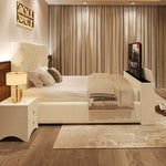 A plush white 2025 The Chiswick TV Bed featuring a diamond-quilted headboard and a hidden television, set in a modern bedroom.