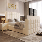 A chic cream upholstered 2025 The Cubix TV Bed with a square-tufted headboard and footboard featuring a pop-up TV, in a contemporary bedroom. 