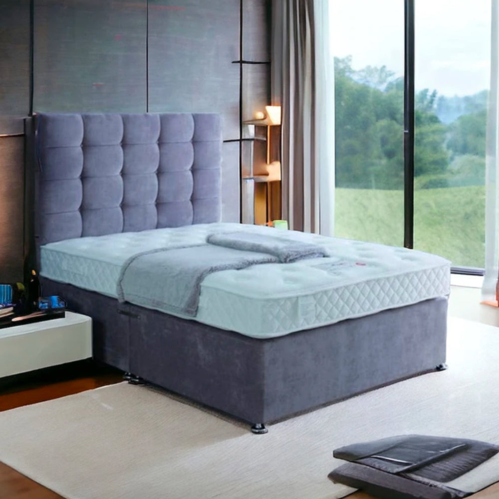 A modern bedroom with a grayish-blue bed and tufted headboard, labeled Excellence 1000. Main image