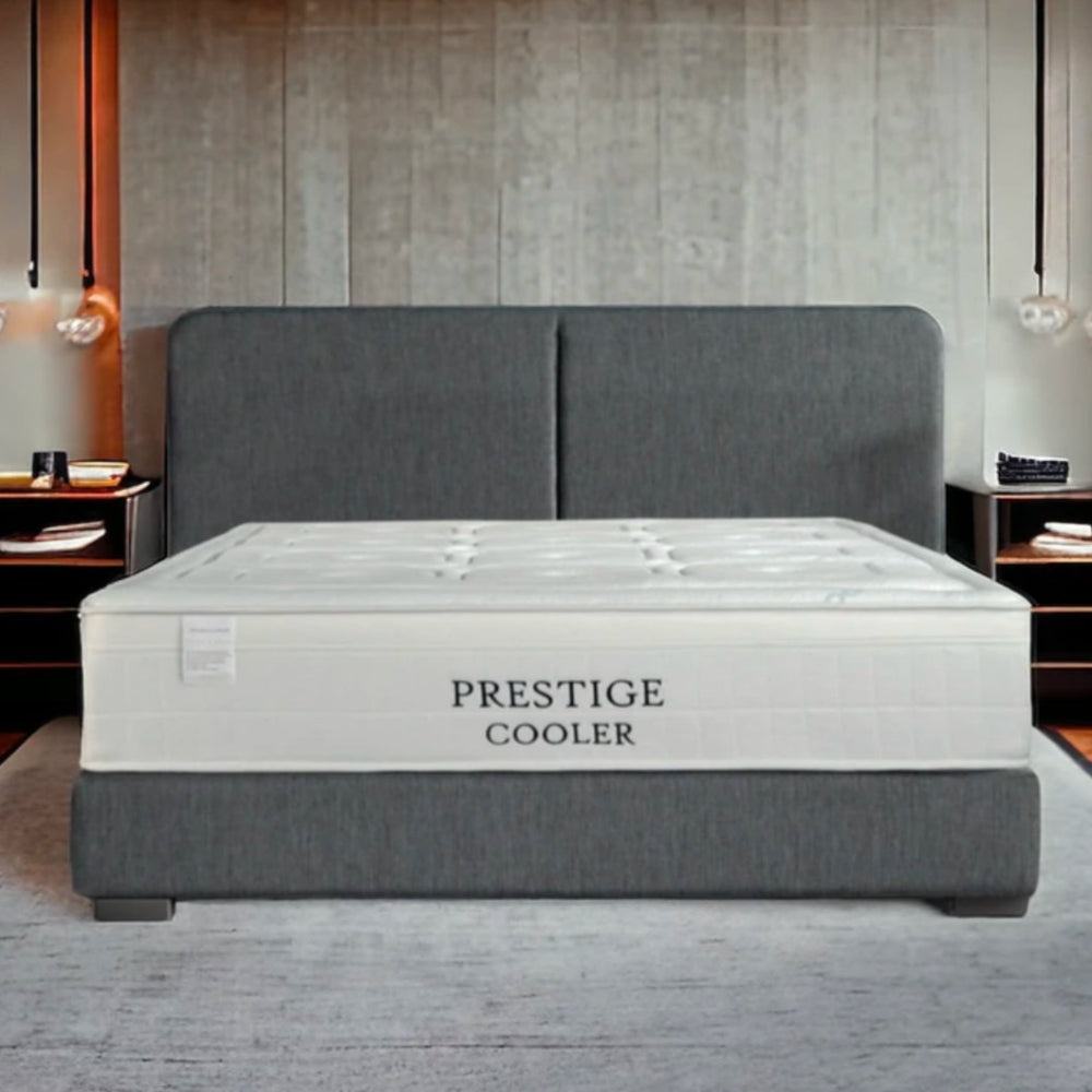 Modern bedroom with a "Prestige Cooler" mattress on a gray bed. Main image