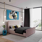 Modern bedroom featuring a Venice Panel Bed in pink, complemented by abstract artwork, stylish pendant lights, and a large window offering a street view.