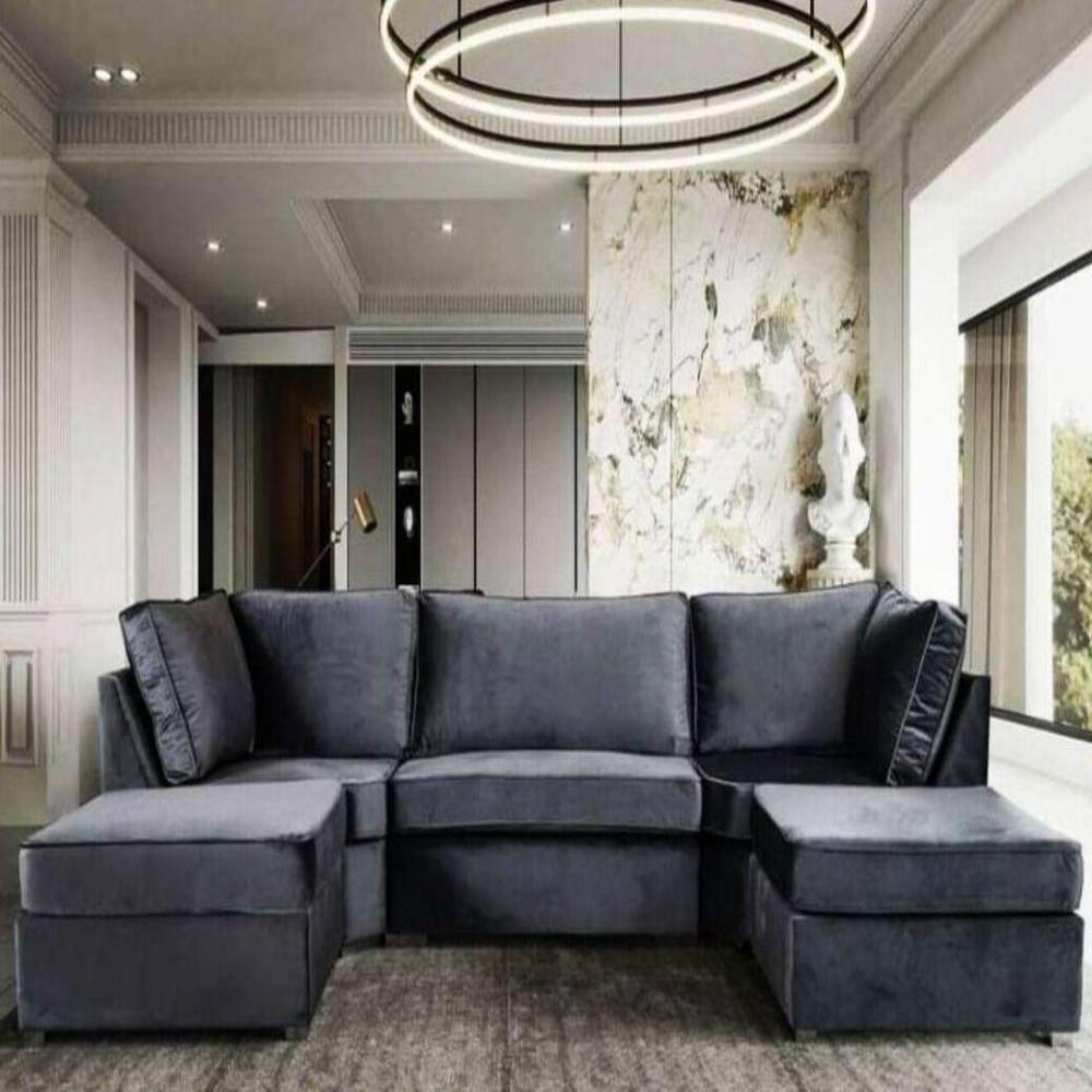 Modern living room with a dark gray sectional U Shape Elveden Sofa sofa, circular light fixture, marbled wall, and large window. Main image